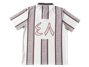 White shirt with black and red patterns on a white background.