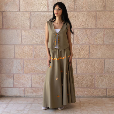 Model wearing the KUVRD Jaffa Orange Tatreez Skirt, full-length styled look