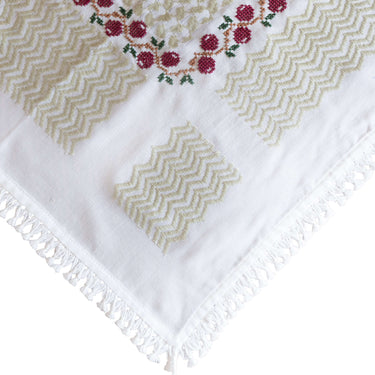 Handmade Olive Zaytoun Tatreez Keffiyeh featuring floral motifs and intricate stitching details.