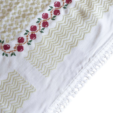 Handmade Olive Zaytoun Tatreez Keffiyeh with intricate tatreez motifs and fringe detailing.