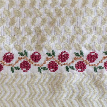 Handmade Olive Zaytoun Tatreez Keffiyeh with intricate olive tatreez motifs and decorative floral embroidery.