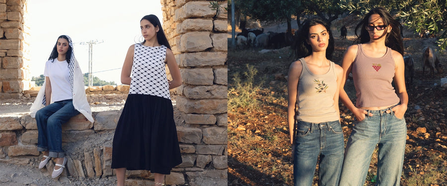 Two women posing outdoors, one sitting on stone steps and the other standing against a stone wall.
