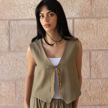 Close-up of tatreez embroidery on the KUVRD Olive Tatreez Vest