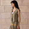 KUVRD Olive Tatreez Vest with hand-stitched Palestinian embroidered edges