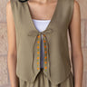 Model wearing the KUVRD Olive Tatreez Vest, layered styled look