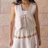 KUVRD Bone Tatreez Vest with hand-stitched Palestinian embroidered edges