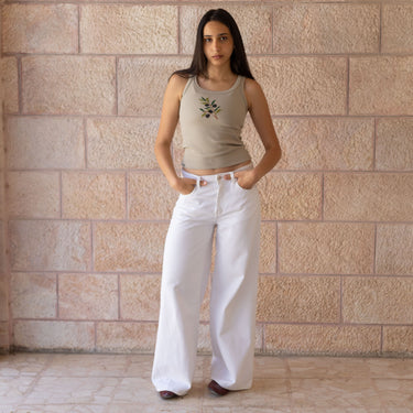 Model wearing the KUVRD Zaytoun Tatreez Tank, front view